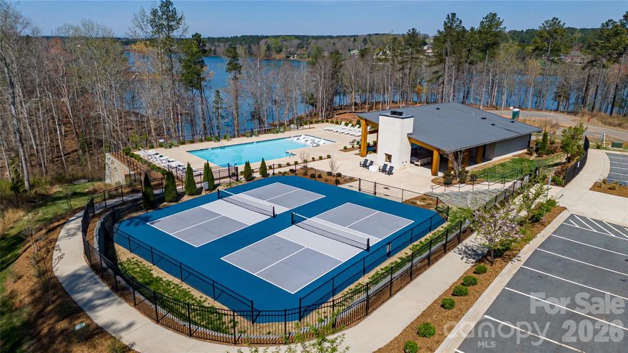 Must see this Lake front lot priced to sell in the beautiful "Lakeside Reserve" community on Lake Rhodhiss. You will be impressed just entering thru the gate to private oasis beside the water. Neighborhood offers many walking/hiking trails and the community center is 2nd to none with inground pool, pickleball courts, and lots of area for cookouts or just family get togethers but the main attraction is the 1.5 acre waterfront lot with its gently sloping topography down to your private beach area. Lot offers approx 130' of waterfrontage and approx 115' of paved road frontage and only $300,000 for an easily buildable waterfront lake lot.