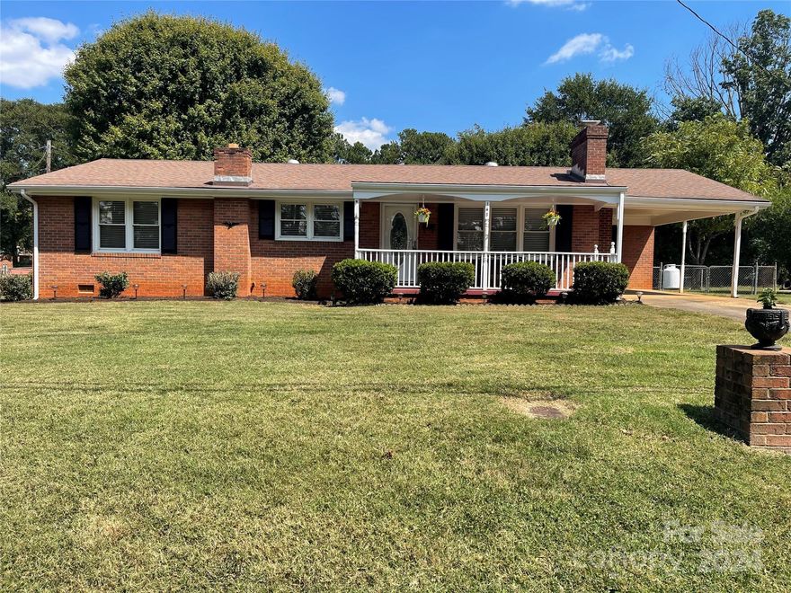 LOVELY BRICK RANCH ON LEVEL LOT CONVENIENT TO SHOPPING AND TOWN. HOME HAS UPDATED KITCHEN.    BARN DOOR OPENS TO A NICE SIZE LAUNDRY ROOM. LIVING ROOM HAS A FIREPLACE WITH GAS LOGS. BOTH BATHROOMS HAVE BEEN UPDATED. ENTIRE HOUSE HAS BEEN PAINTED INSIDE AND HAS NEW LVP FLOORING. FRENCH DOORS FROM THE DINING ROOM LEAD OUT TO COVERED PORCH FOR OUTSIDE ENTERTAINING. LANDSCAPED YARD AND THERE IS A 12 X 20 OUTSIDE BUILDING WITH ELECTRICITY.