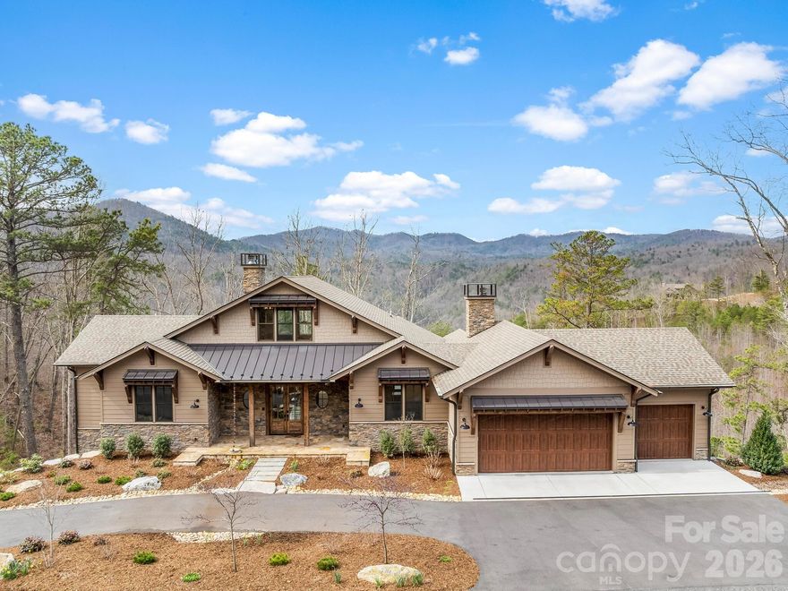 Tucked away in the gated conservation community of French Broad Crossing, 567 Wild River Run is a stunning sanctuary offering long-range mountain and sunset views! This retreat is perfect for daily living or a second-home all while enjoying an elevated mountain experience. Elaborate neighborhood amenities are all added luxuries that add to the appeal of life in French Broad Crossing. Spanning over three levels, with 3500+ heated square feet, and a 3-car garage, this home offers thoughtful design and features that await your arrival. The primary bedroom and bath are on the main level offering a spa-like ambience with his and her vanities, spacious walk-in shower, soaking tub, heated floors and towel bar, and a luxury bidet. There is also an additional bedroom, bath, and half bath on this level. The open concept living area with a chef's kitchen is well-appointed with direct access to the screened porch inviting cozy evenings by the fire. Functional indoor living meets elevated outdoor living that provides Trex decks and porches for taking in the stunning sunsets or relaxing in the shade. As the heart of the home, the kitchen features leathered granite countertops, knotty alder cabinets, Thermador appliances, large kitchen island, and walk-in pantry. The great room has soaring ceilings and built-ins for those special mementos. It flows with a beat of luxury, yet it's cozy and comfortable. There is a large mudroom off of the garage that is equipped with an added bonus of a pet washing station! The upper level features an open loft that could serve as an office or sitting area with a view! The lower level features a built-in bar adjacent to the second great room. There are also two additional bedrooms and bathrooms, one of which is an en-suite. If storage is a must, look no further! There are two extensive storage areas that round out the lower level. With two large decks, screened porch, and front porch, outdoor living is at its finest. This home delivers on functionality without compromise and also includes a whole-home generator for peace of mind. Asheville, Marshall, Hot Springs, and Weaverville are all in close proximity for dining and entertaining adventures as well as providing easy access to life's necessities. After a long day of exploring the hiking/ATV trails right out your door, relax at your personal safe haven in French Broad Crossing. Enjoy evenings at the lodge, by the pool, or riverside. The choice is yours! French Broad Crossing is the ideal outdoor playground to take you away from the daily hustle and bustle. Breathe easy.