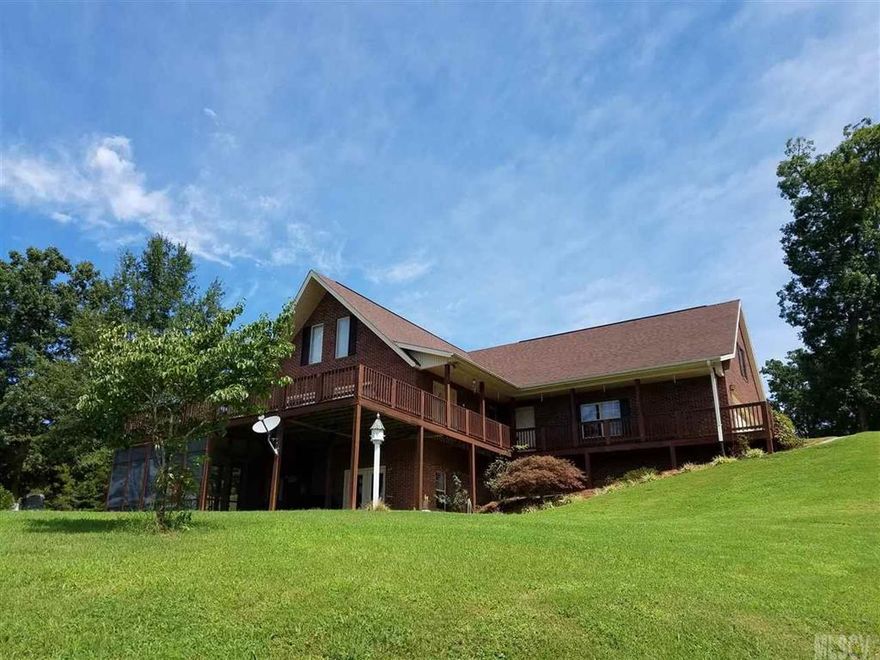 Be it year round or a weekend “get-away” it is an awesome location not far from Statesville, Hickory, Taylorsville, or even Charlotte.  This beautiful and spacious all brick home is as comfortable as it get.  The first and second floors have 2,700 feet of heated/finished space, while the huge basement is not finished, it wouldn’t take much to do so.  Even as it is there is the making of a great recreation area in the basement now.  Enhanced with a screened in porch, open deck and a floating dock with amazing views.  The double garage is huge, twice the size of a typical garage; with room for vehicles, yard toys and lots of tools.  The closets are huge and the Bonus room is awesome.  The drive is only one mile off the main road.  Don’t let the term modular concern you, this is an extremely well built home, come take a look for yourself.
