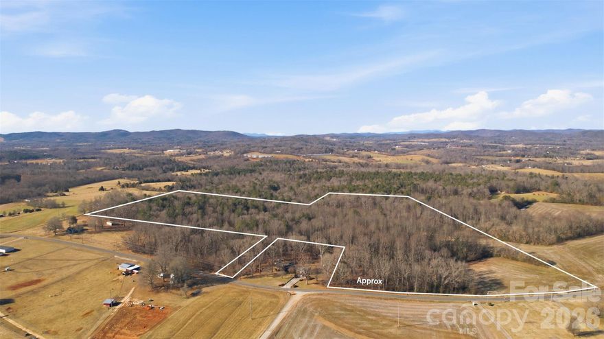 34.33 Acres in the Highly Desirable Ellendale Community – Alexander County! Discover the perfect blend of privacy, beauty, and opportunity with this exceptional 34.33-acre tract located in the sought-after Ellendale community of Alexander County. Whether you’re dreaming of building a private estate, a family compound, or a multi-generational retreat, this property offers the space and flexibility to bring your vision to life. With multiple areas ideally suited for building, you can choose the perfect homesite to capture peaceful views and natural surroundings.  A picturesque creek flows through the property, adding charm, character, and a peaceful natural setting. Imagine relaxing to the gentle sounds of running water, creating walking trails along the creek banks, or designing your homesite to overlook this beautiful feature. The land features a healthy stand of mature hardwoods, including poplar, white pine, white oak, and red oak—adding both natural beauty and potential timber value. Enjoy the convenience of county water availability while still embracing the privacy and serenity of country living. There’s ample room for a custom home, guest house, barns, gardens, recreational trails, or simply space to spread out and enjoy nature. Opportunities like this—large acreage in Ellendale—are becoming increasingly rare. Whether you’re a single home builder looking for room to create your dream property or a family seeking space to build together while maintaining privacy, this tract offers endless possibilities.