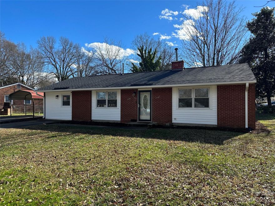 Amazing 1950's mid-century partial brick ranch home with a modern flare, updates galore and most just completed in 2024 such as a new 30 year architectural shingle roof, new gas furnace, new HVAC, new vinyl siding, new soffit, new facia, and new gutters. Once inside the home, you will find custom concrete floors and a very spacious floorplan with large living room, and separate great room. The flex room doors were taken off by previous owners but can easily be added back to turn it back into the three bedroom house it originally was. This large corner lot provides a very spacious yard, fenced in backyard, carport, and separate storage building with outdoor fireplace.