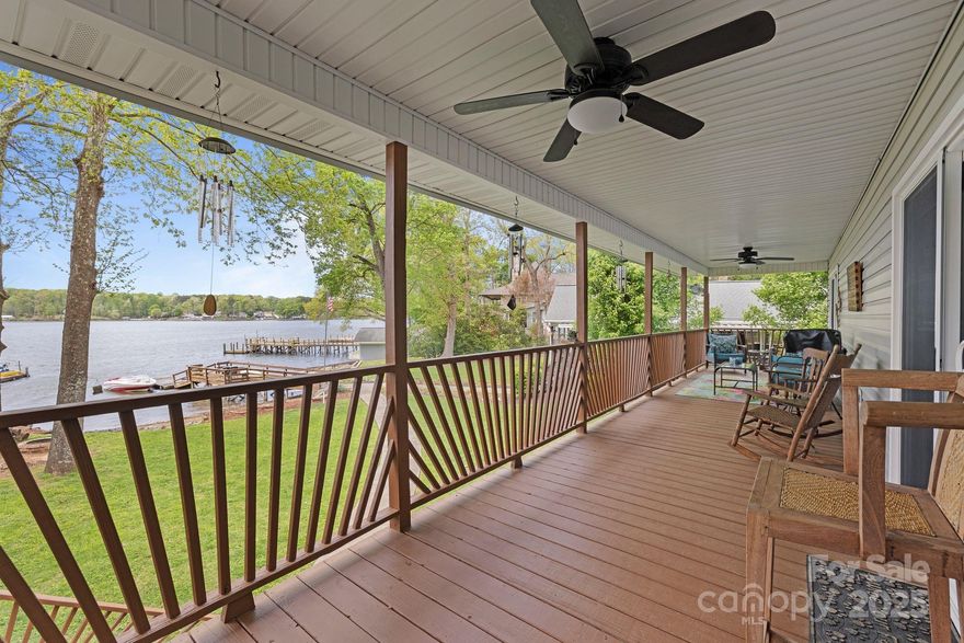 You will LOVE the GORGEOUS LONG-RANGE LAKE VIEWS from your expansive covered deck, primary bedroom, living room, walkout basement & the EASY LEVEL WALK to the shared dock and beach area!  Sit back and relax in the outdoor hot tub that conveys! All new windows in 2023!  2 New sliding doors & new dishwasher!  Extra room and also workshop in the basement!  Stove and gas grill connected to propane!  Buddle Creek Public Boat Ramp access only about a 6-minute drive!  Pre-approved buyers welcome!