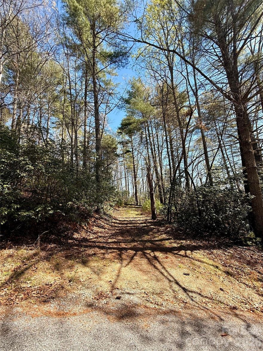Discover the perfect blend of privacy and convenience with this charming wooded homesite in the desirable Emerald Hills subdivision. Nestled just off Hart Road in Pisgah Forest, this property offers quick access to outdoor adventures in DuPont State Forest and Pisgah National Forest.
A 3-bedroom septic permit is already on file but expired. The lot features a rough-cut driveway and partial clearing, saving you time and effort. With additional clearing, there’s ample potential to build and truly customize your surroundings.
Go Green Builder house plans are also available with an acceptable offer, providing a head start on creating an efficient, thoughtfully two bedroom and two bathroom designed home. Or opt to create your own home design.
Don’t miss this opportunity to own a peaceful retreat in a serene, natural setting—schedule your visit today.