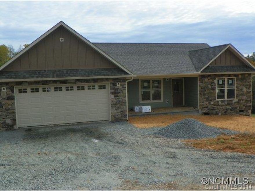 Main level living in this lovely new construction. There is still a little time for buyer choices.  Better hurry though, these houses don't last long! Open floor plan w/wood & tile flooring,  beautiful stone fireplace w/gas logs. Kitchen cabinets have been ordered.  Picturesque neighborhood close to quaint downtown Mars Hill.  Some construction pics as well as pics of similar completed house.  Taxes are on lot only.