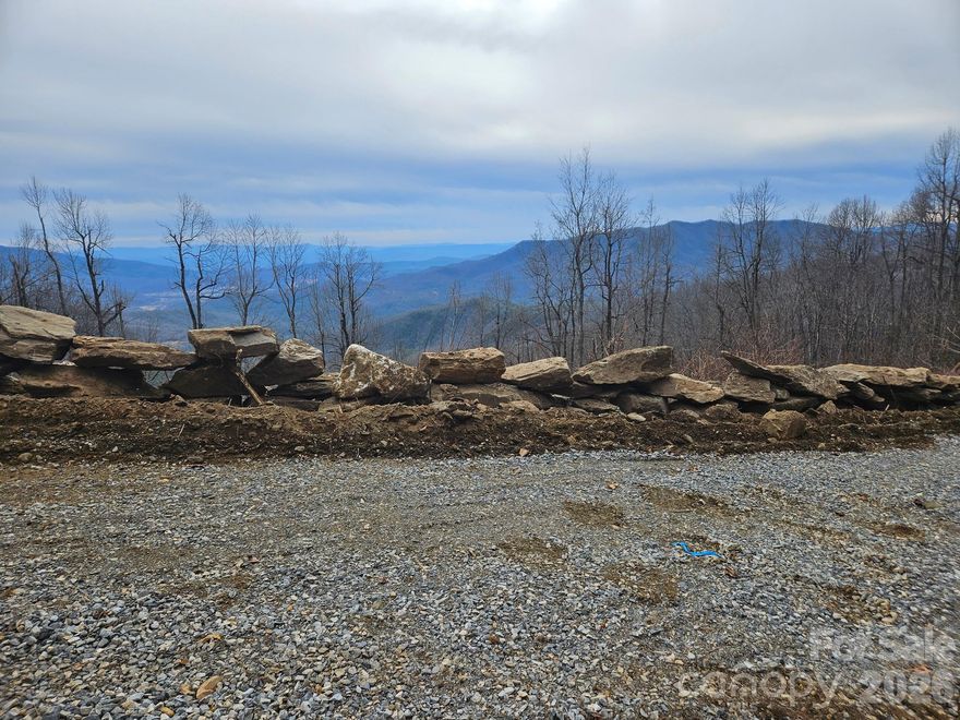 One of the last PREMIER VIEW LOTS left in Little Switzerland. 180 degree views looking South and East. Take in the panoramic views of Hawksbill, Table Rock. Linville Mountain, Woods Mountain, Pompey's Knob and the South Mountain Range. Located off Historic Osbourne Knob which was part of the original 1909-1910 Judge Hariot Clarkson Switzerland Company Development tract. A rocks throw from the Blue Ridge Parkway at an elevation of roughly 3,300 feet. Enjoy evenings at the nearby Switzerland Inn, dining in the lodge or The Foul Play Pub....featuring music on the weekends. Spend a relaxing afternoon at one of the local wineries or at Lake James. Just a short drive to Asheville, Boone, Banner Elk and Johnson City, TN. Several hiking trails, golf courses and ski resorts close by. New Survey and an improved road already into the property. Perfect place to build your Dream Home.