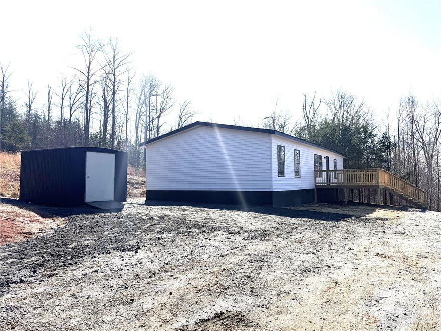 2010 Year Model Approximately 1404 Sq Ft Clayton Manufactured Home. 3 Bedrooms, 2 Full Baths, Primary Bedroom - Bath with Walk in Closet, Dual Sinks Vanity, Soaker Tub and Separate Shower. Large Family Room, Kitchen with New Range and Refrigerator. Dining Area, Central Heat and Air, Permanent Foundation, Private Well and Septic, 2 Private Acres, Gorgeous Mountain Views! Newly Remodeled Interior and Exterior! New Roof!