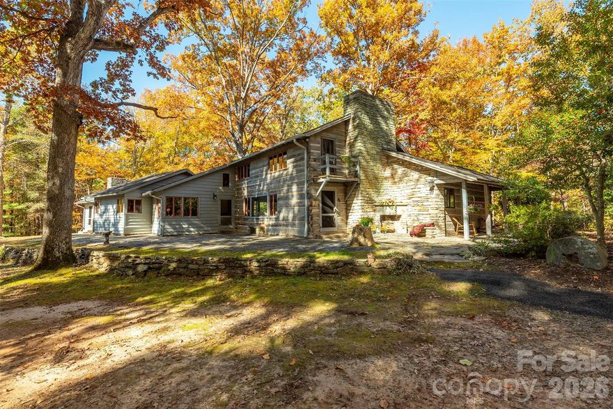 A RARE opportunity to own a true Western North Carolina icon on beautiful, easy-to-build acreage, just minutes to downtown Columbus!! This distinguished family home—constructed with logs transported from a cabin in Tennessee—is steeped in local history and timeless character. Long celebrated as a gathering place for the community, the property spans 18.27+/- picturesque acres, with the option to purchase additional surrounding land. The 18.27-acre parcel is part of a 55-acre parcel that will be surveyed and divided prior to close. See MLS #4295084. Purchase the home with 4.5 acres. See MLS #4211548.  Contact listing agents for details.

Ideally located within walking distance of downtown Columbus and just minutes from I-26, this estate offers convenient access to Asheville, Greenville, SC, and three major airports—perfectly balancing historic appeal with modern accessibility.
Step back in time and imagine the possibilities! This historic home features five fireplaces, a magnificent hand-laid rock chimney, a slate roof, and wormy chestnut details throughout, showcasing the masterful craftsmanship of a bygone era.
The pastoral setting, combined with wooded privacy and sweeping grounds creates endless potential. Restore it as a grand private estate with ample surrounding acreage, design a multi-generational compound, build multiple rental units or create a communal living compound.  Convenient access to city water and sewer make the options countless! 
(Tax records currently reflect 55 acres).