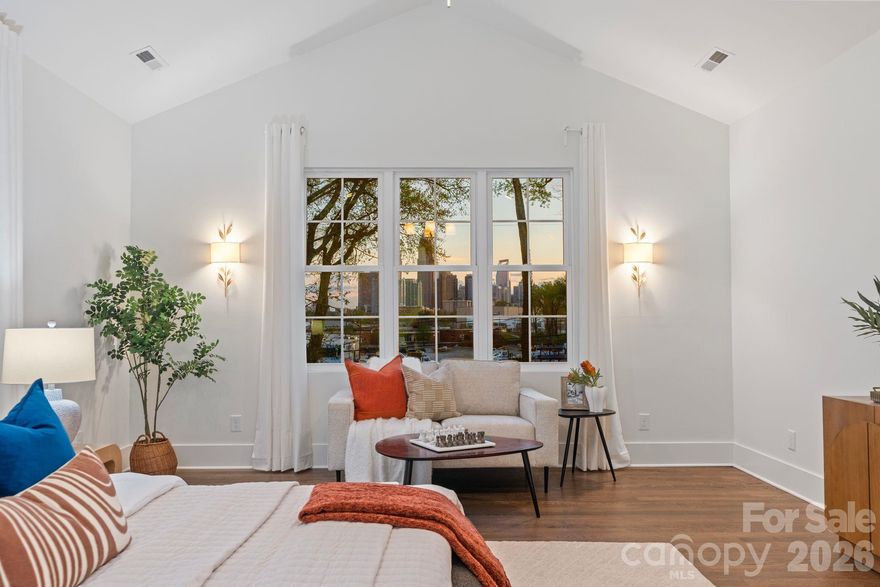 Stunning new construction with jaw-dropping Uptown skyline views the moment you walk through the front door—this is the kind of first impression buyers never forget. Perfectly positioned to capture the city, this home blends modern living with an unbeatable location just minutes from Camp North End, Uptown, and everything Charlotte has to offer.Designed for both everyday living and entertaining, the open-concept floor plan features a spacious kitchen with a large island, seamless flow into the living room, and direct access to a covered patio overlooking the backyard and skyline beyond. A dedicated back kitchen/scullery keeps prep, appliances, and clutter tucked away—giving you the best of both function and style.Upstairs, the primary suite offers generous space, a large walk-in closet, and a well-appointed bath, while additional bedrooms and a flexible layout provide room for guests, office space, or growing needs. Step outside to a fully fenced backyard offering privacy and room to create your ideal outdoor retreat—all while enjoying rare city views.Walkable to Camp North End and close to NoDa, Plaza Midwood, and Uptown—this is urban living with space, style, and a view that truly sets it apart.