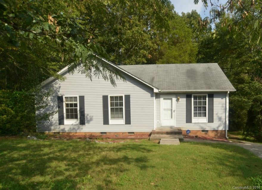 3 bedroom, 2 bath home with fresh paint and hardwoods throughout. Galley kitchen with range and refrigerator included. Large living area. Deck overlooking wooded backyard.