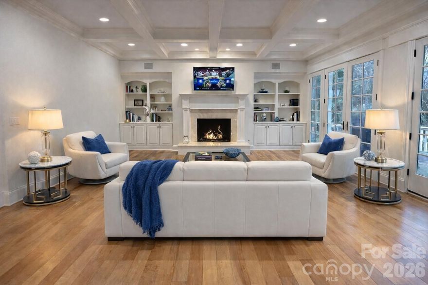 Nestled within one of Charlotte’s premier luxury ZIP codes—with unrivaled proximity to SouthPark Mall, renowned restaurants, lifestyle conveniences, and exceptional private schools—this residence blends classic architectural grace with modern sophistication. This well apppointed home is priced below the appraised value. Appraisal available upon request.
A grand Southern foyer welcomes you into an atmosphere of refinement, flowing effortlessly into a dramatic coffered-ceiling great room, an elegant dining salon, and a chef’s kitchen appointed with bespoke cabinetry and high-end appliances. Seamless indoor-outdoor living is enjoyed through a screened porch and an expansive open terrace overlooking the grounds.
The main-level primary suite offers a sanctuary of serenity, showcasing a coffered ceiling and a spa-inspired bath. Also on the main floor: an impressive French-doored executive office, a secondary private office, a well-appointed utility wing with drop zone, and exceptional circulation designed for ease of living.
The upper level hosts three bedrooms, two full baths, and a flexible bonus room that may serve as a fourth bedroom or lounge. A private third-floor suite offers the ideal retreat for guests, in-laws, or an au pair, creating a truly multi-generational footprint.
The walkout lower level elevates entertaining with a custom wine cellar, full bar, billiards area, fireside living room, guest suite, fitness studio, theater room, office, and workshop—each space thoughtfully designed for connection, comfort, and leisure.
Discover the essence of timeless Southern luxury in this distinguished 7-bedroom, 5 full and 2 half-bath estate, offering more than 8,000 square feet of curated living across three levels and a private walkout lower level. Additional features include a three-car side-entry garage, walk-up workshop/storage, exceptional storage throughout, and gated community access for enhanced privacy and security.
Steeped in craftsmanship, enriched with modern amenities, and positioned in one of Charlotte’s most coveted luxury enclaves—this estate embodies the enduring elegance of Southern living at its finest.