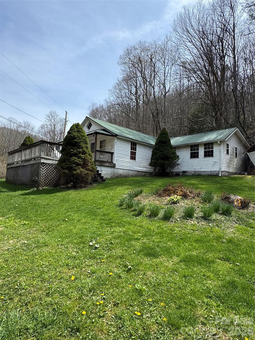 Searching for your own slice of mountain paradise in Western North Carolina? Look no further. This charming three-bedroom, one-bath home sits on 24 scenic acres, complete with a flowing creek that winds along the bottom of the property. Currently tenant-occupied through the end of June, this property offers incredible potential. Whether you’re dreaming of building a primary residence on the acreage while converting the existing home into a guest house or VRBO, the possibilities are endless. The home is of no value. Enjoy the unique bonus of trout waters right in your front yard. The property also features old roadbeds that could easily be maintained and repurposed as ATV or walking trails. Conveniently located just minutes from Linville Falls Winery and the town of Newland for shopping, dining, and everyday needs, this is a rare opportunity you won’t want to miss. Schedule your showing today, this one won’t last long! Interior Showings of the Interior of the Home, just for purpose of condition, will be available after May 15th. Property being sold for LAND VALUE only. No Value is given to HOME. There is an Easement along the right property line for the adjoining neighbor on the top of the hill.