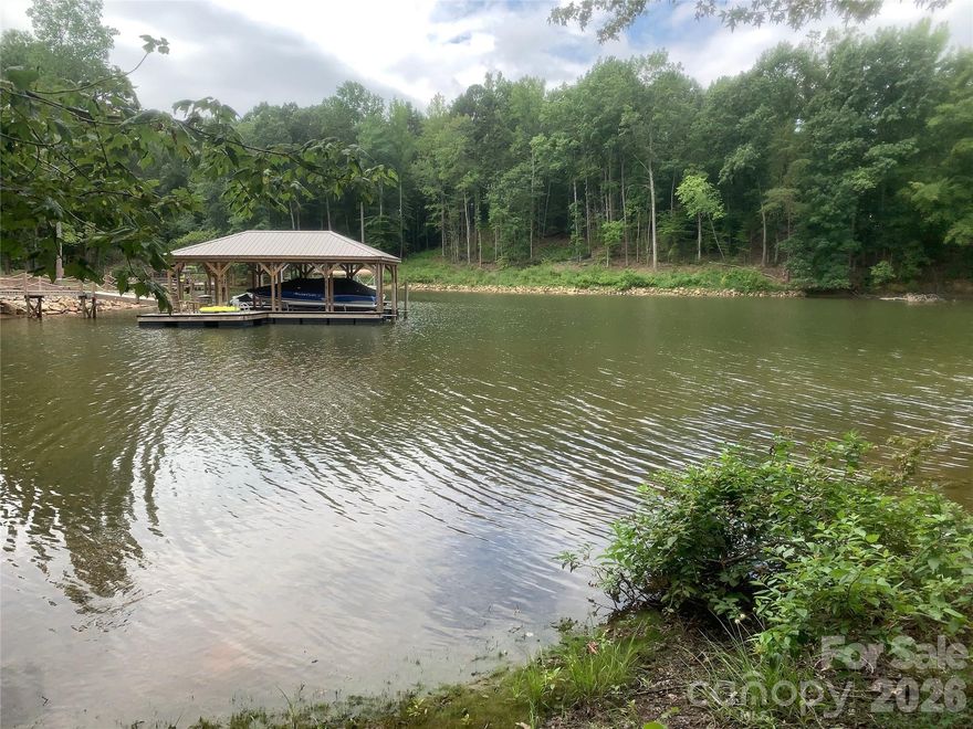 One of the few remaining waterfront lots in Shavenders Bluff. This lot is .99 acres and includes a Highly Sought After deeded boat slip walking distance from your front door. Community amenities include a waterfront park with beach access, picnic area, boat launch, boat storage, pool, and walking trails. Excellent location in a quiet community but short minutes away from dining, shopping, major medical, and interstate access.  Use your own builder, no time frame to build.