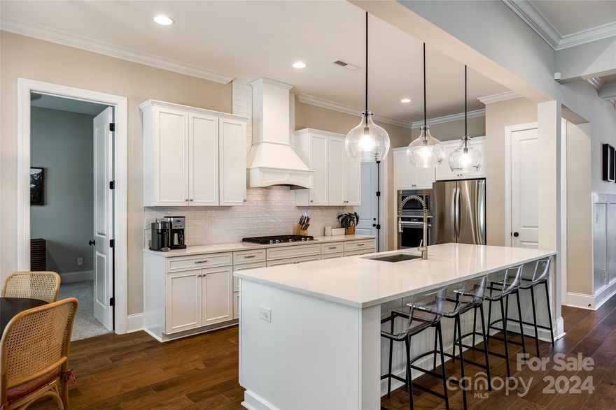 This beautiful custom brick home is located in the lake front community of Handsmill on Lake Wylie. The spacious 5-bedroom, 4-bath home sits on a quiet, .64-acre cul-de-sac lot with a well-established yard, irrigation system and wooded areas. An open main floor showcases a dining room, spectacular kitchen with breakfast area, upgraded cabinets, quartz counter tops, gourmet appliances and heavy trim. Double sliding glass doors allow you to enjoy the backyard from inside and out as they open to a spacious covered deck. Guest suite on main level has an en suite bathroom, perfect for guest privacy. Handsmill on Lake Wylie is a premier custom home community, featuring a quiet atmosphere, beautiful community pool overlooking Lake Wylie, clubhouse with fitness center, and minutes from top rated Clover schools, restaurants, and shopping. Low property taxes! (Property tax data is incorrect on most websites. 2023 taxes were $4,722. 2024 taxes are $4,605.25). Make this your home today!