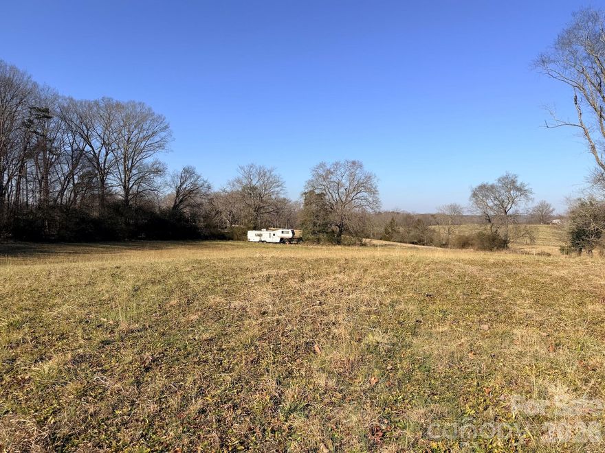 A blank canvas full of potential with this 2.78-acre flat lot in a quiet country setting. The property offers plenty of space to build your dream home, with open land and walkable woods toward the back. Conveniently located in Anson County near the Union and Stanly County lines, with the town of Oakboro just minutes away for shopping and dining. The lot has access to Anson County water, no HOA and a usable lot layout. Enjoy peaceful living with everyday conveniences close by. This is a judicial sale.