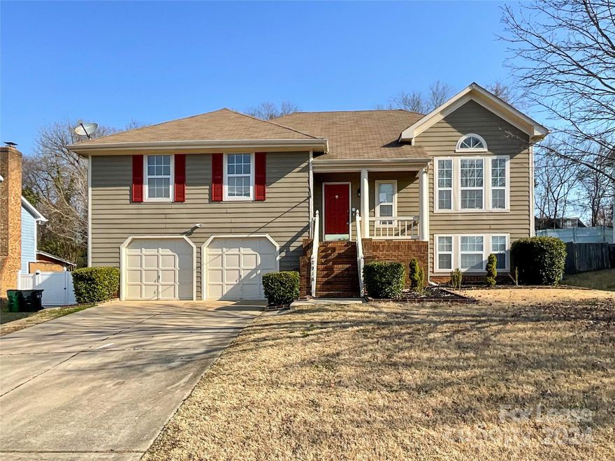 This 4 bed, 3 bath exceptional home is located in the vibrant city of Charlotte, NC. Step into the great room and be captivated by the soaring ceiling, creating a sense of grandeur and space. Ceiling fans throughout the home ensure optimal comfort. The kitchen is a gourmet's dream, with plenty of cabinet and counter space to prepare and store your culinary delights. The breakfast area overlooks a beautiful park-like yard and double deck, perfect for enjoying the outdoors. The fenced yard provides privacy and security. The large rec room features a wet bar and fireplace, offering a cozy and inviting space for relaxation and entertainment. With ample room and a separate full bathroom, this versatile space can be customized to suit your needs. Don't miss the opportunity to claim this incredible home, where open space, natural light, and thoughtful design come together in perfect harmony.