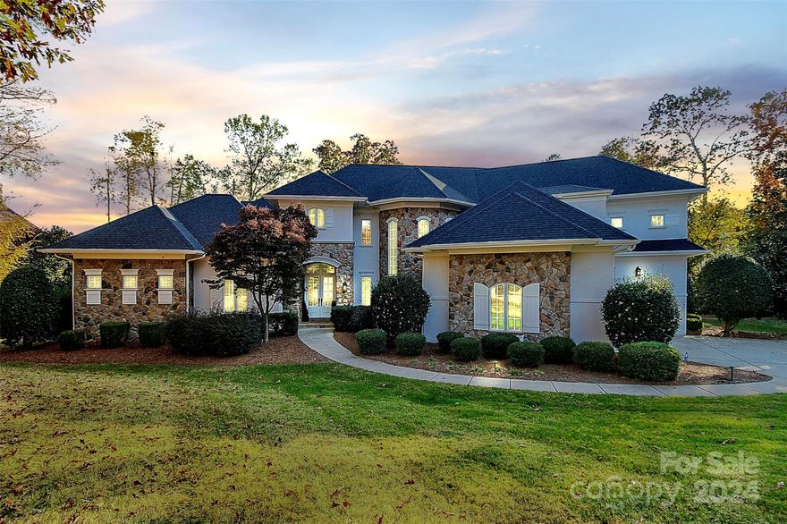 Stunning waterfront property located on 1.75 acres of serenity on Lake Norman w/ deeded boat slip. Enjoy breathtaking year-round views across this immaculate home in highly desired community, The Point. Take in the views on the covered back porch w/ flagstone flooring & beautiful beadboard ceiling. Private boardwalk along the lake. NEW ROOF and floors in 2023. This impeccable home offers a desirable open floor plan great for entertaining w/ a chef’s kitchen opening to an inviting family room. Kitchen recently renovated and features large island, gas range w/ custom hood, quartz countertops and walk-in pantry. Walkthrough bar area between breakfast & dining. The primary bedroom w/ tray ceiling, modern bath & large closet w/ custom shelving. First floor office w/ vaulted ceiling. Upstairs includes 17x29 media room w/ bar, flex area & storage. Three very spacious bedrooms with full en-suite bathrooms and an additional bonus/flex room 16x17 w/ closet.