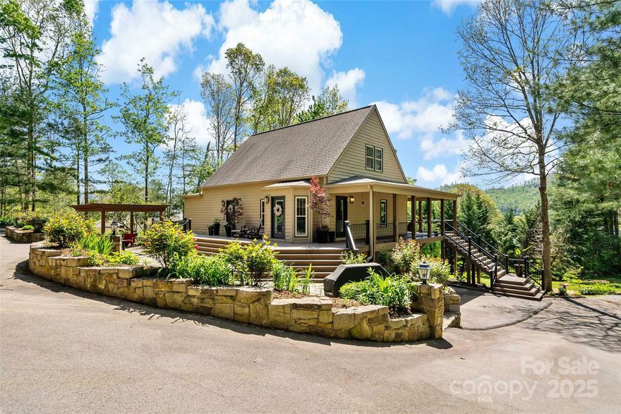 Location is key for this one-of-a-kind home in the Cane Creek Valley of WNC. Your private oasis awaits with a large .83 acre lot with outdoor spaces such as the new wrap around engineered deck, stone patio, fire pit and two outdoor sheds for storage. Convenient one level living with a primary suite, dream closet, and updated bath on the main level. Highlights include gleaming hardwood floors, a remodeled kitchen, and beautifully updated baths. Upstairs, you'll find 2 generously sized bedrooms and closets, and the finished basement provides additional living space. The property offers an easy, low-maintenance lifestyle with a large wrap-around, engineered deck and liquid vinyl over cedar siding. This house lives like a new build with the extensive updates. You won't want to miss this gem, perfect for both everyday living and entertaining.