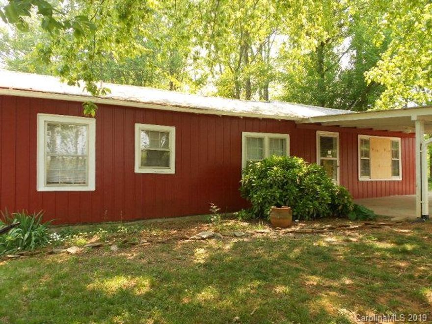 2 BEDROOM HOME  and +/- 1.2 acres, Outside the city limits on paved road.  Home is approx. 950 square feet and includes a living room, kitchen, and dining room.  Owner has replaced all the electric, new bath, new kitchen, recessed lights on dimers in living room, new holding tank, new water heater, new well pump, new kitchen floor, new interior doors, and updated outlets and switches. Appliances are black and stainless. Home also has a transferable termite bond on it with Right Way Pest.