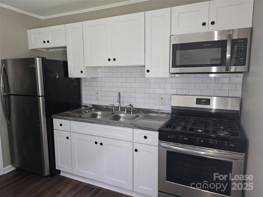 Looking to live close to Uptown Charlotte? This charming and fully renovated 2 bed, 1 bath condo in a quiet, up and coming neighborhood is just 5 minutes from Uptown Charlotte! Conveniently located near dining, shopping, and major Interstates I-77 and I-85, this condo offers easy access to everything Charlotte has to offer. Kitchen has stainless steel appliances (refrigerator, gas range, microwave) and an all-in-one washer/dryer for your convenience! Relax and enjoy the covered front porch and deck. Utilities Included: Water. It's move-in ready. Apply today!