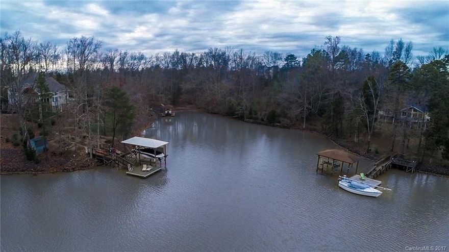 Beautiful waterfront lot that is minutes to Lake Wylie shopping, restaurants, and amenities. You will be blown away by the beautiful views and the peaceful setting. The homesite is located within a community without any HOA dues or HOA restrictions. A roadside buffer offers the ultimate sense of privacy.  There is approximately 170' of shoreline with excellent water depth.  The lot offers fantastic views and is ideal for a walkout basement. Listing agent is the owner.