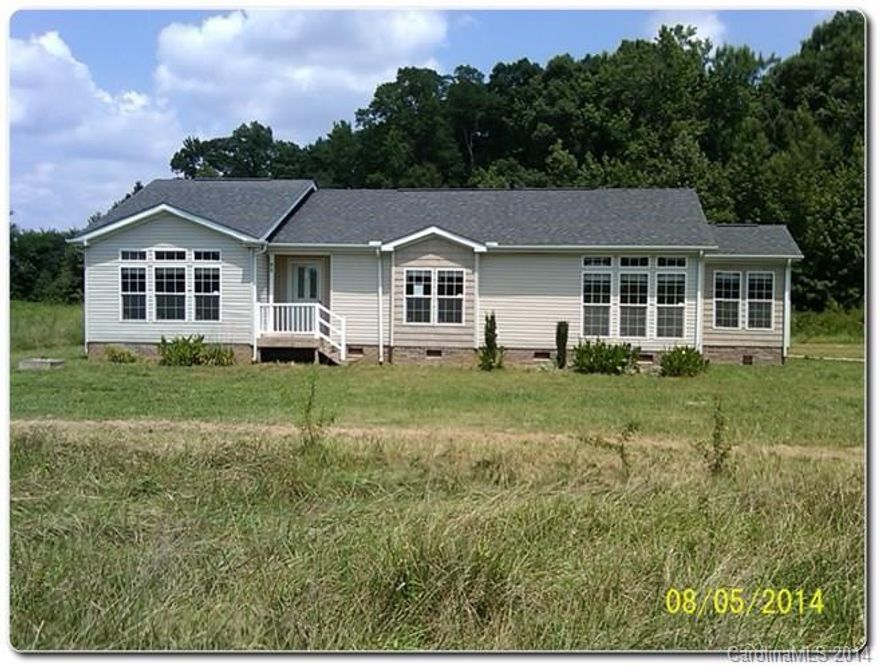Stunning Modular home in Shelby! Home has tons of character with differing vinyl siding accents on exterior, large deck. Interior is gorgeous with floor to ceiling windows that take advantage of the view in dining room. Very open floor plan, kitchen is enormous with plenty of cabinet space. Master suite has garden tub with separate shower. Home has so much natural light very pleasant on interior