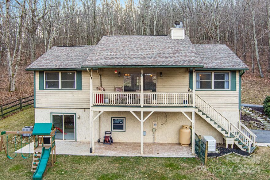 In the serene embrace of the mountains, this 3 br home offers a perfect blend of comfort, style, and privacy. Designed with an intuitive layout, the residence thoughtfully separates the sleeping quarters for optimal relaxation and tranquility. On one side, two bedrooms share a full bathroom. The primary suite, situated on the opposite side of the home, is a haven with two large walk-in closets. The spacious open floor plan features a magnificent large island that stands as the centerpiece for culinary exploration and social gatherings. The basement is thoughtfully designed to include an office and a bonus room, accompanied by a full bathroom, offering versatile spaces for work, play, or additional lodging. This property is not just a home; it's a sweet escape into nature's lap, promising a lifestyle of peace, privacy, and unparalleled beauty. A must-see listing that captures the essence of mountain living while providing all the modern comforts and luxuries one could desire.