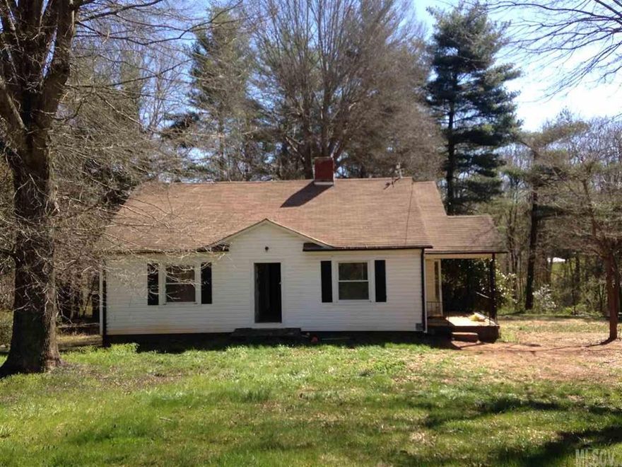 Cute bungalow with character in need of repairs. Being Sold AS IS. Large, usable lot and bsmt cellar for storage. Has central heat pump (unsure if functional), vinyl siding and replacement windows. Needs appliances and repairs throughout. Side porch, some HW floors and brick FP (unsure if functional).