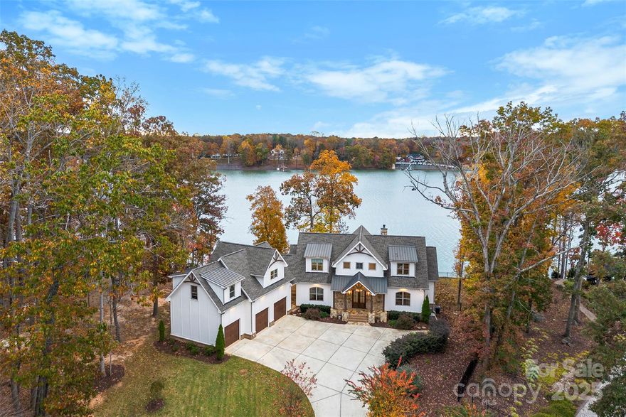Experience waterfront living at its finest, with 330 feet of pristine main channel shoreline in beautiful Belmont.
This stunning 3-bedroom, 3.5-bath custom home perfectly blends modern luxury with timeless design — all set on a full 1-acre lot with breathtaking lake views.
From the moment you step inside, you’ll be captivated by the curated style, high-end finishes, and thoughtful details throughout. The main home features an open and inviting layout, ideal for entertaining or relaxing while taking in the water views from nearly every room. The chef’s kitchen showcases premium appliances, custom cabinetry, and elegant finishes that elevate everyday living.
Upstairs, you’ll find beautifully appointed bedrooms and spa-inspired bathrooms, while the full basement provides endless opportunities.
Outside, enjoy peaceful mornings or sunset evenings overlooking the lake. A dock permit is already secured, giving you the rare opportunity to easily complete your ideal waterfront lifestyle.
Adding even more value, this property includes a second living quarters above the garage—complete with its own kitchen, laundry, bedroom, and full bath—perfect for guests, in-laws, or rental potential. The 3 stall garage extra storage, an area for your dogs that attaches to a fenced area just for them.
Located in the sought-after Belmont area, this home offers the best of both worlds: a serene retreat with convenient access to dining, shopping, and everything the Lake Wylie area has to offer.
Luxury. Views. Lifestyle. This home truly has it all. Agent is owner.