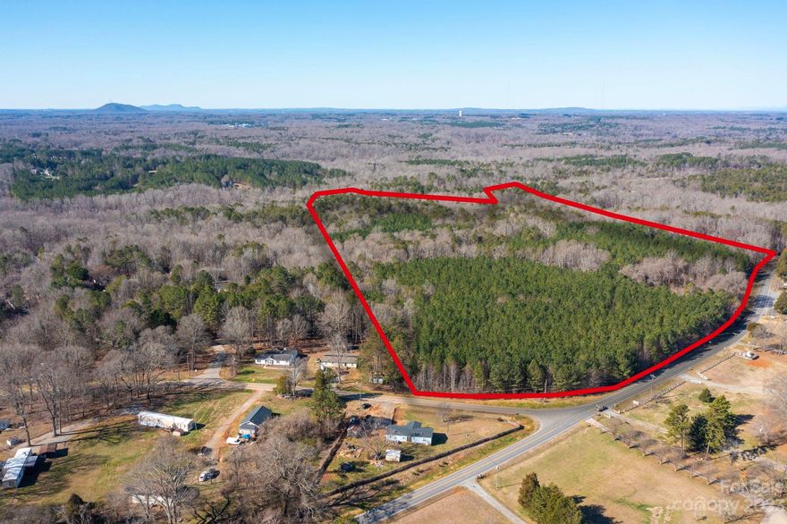 Opportunity is available to own this 74 acre piece of paridise in Mount Holly. Located on the corner of Lowland Dairy Rd and Sandy ford Rd. This lot has street frontage of approx 1473 feet on Sandy Ford Rd. Check out the parcel map outlining property boundries. Many neighborhoods surround this area with homes selling over 400k. There is a walking tral in the center of property which takes you through the lot. Sewer connection 2500 feet away. Call today for more information.
