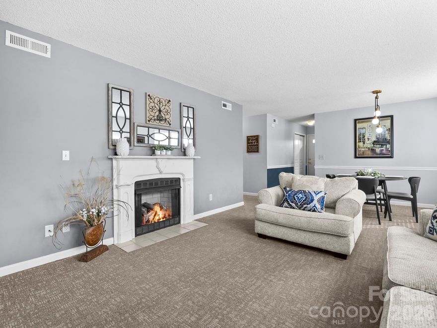 PRICE IMPROVEMENT!!!  Step into this charming, yet luxurious, upper level 2-bedroom condo offering high-end finishes and incredible community amenities.  Experience the perfect blend of style and functionality in the efficiently designed kitchen, featuring sleek Silestone quartz countertops, stainless-steel appliances and custom-built cabinetry.  This cozy home features an open dining/living area full of natural light and comfort of a new gas fireplace perfect for entertaining guests. Just off the living room, you'll find a private, screened-in balcony where you can relax and enjoy sipping on your favorite beverage.  Front porch sitting is also a plus with a peaceful view of the community pond. At the end of the evening, retire to a comfortable, yet cleverly designed primary bedroom with en-suite bath.  Located walking distance from the clubhouse where you can enjoy a game of pickleball, billiards or a swim in the heated pool.  You'll also find a calendar full of diverse activities with excellent community participation.  Living and dining room furniture included with acceptable offer.  Perfectly situated less than 10 minutes from downtown Hendersonville, shopping and medical facilities, 30 minutes to downtown Asheville and 30 minutes to the Land of the Waterfalls in Brevard, NC.  Don't miss your opportunity to make this your forever home or home away from home in the lovely, gated community of Wolfpen!