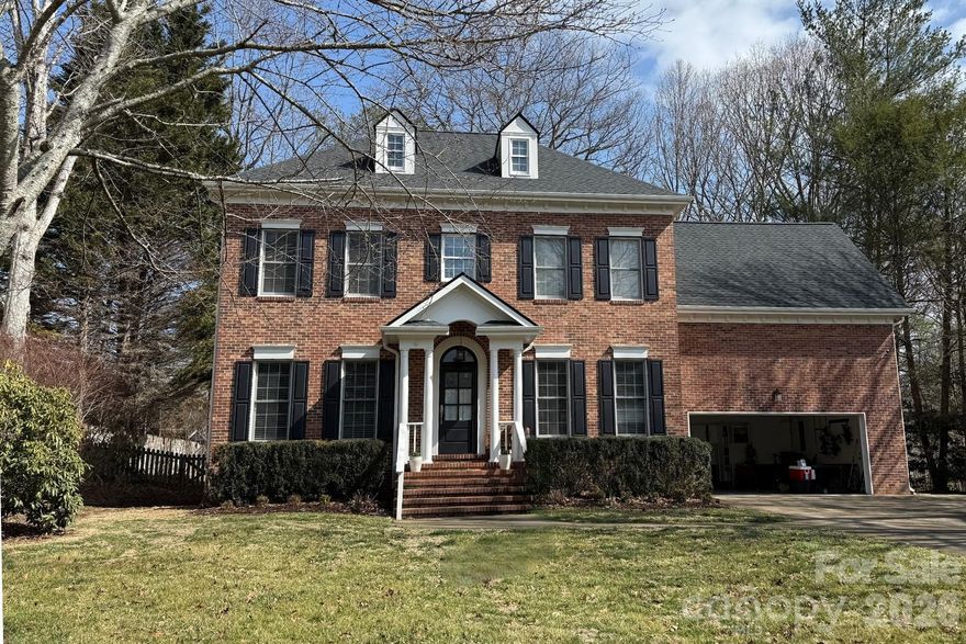 Photos coming soon! Made Live without photos to allow for requested showings. 

Welcome to this beautifully updated 4BR/2.5BA two-story brick home in sought-after Biltmore Park. Situated on a level lot with a fenced backyard, this home offers timeless curb appeal and thoughtful modern updates throughout. A beautiful winding staircase and elegant two-story modern chandelier create a grand first impression. The main level features a light-filled chef’s kitchen wrapped in crisp whites and polished stainless steel, a refined flex space perfect for a private study, a warm and inviting family room anchored by a gas fireplace, a charming breakfast nook, and a well-appointed mudroom with utility sink.

Retreat upstairs to a spacious primary suite complete with a thoughtfully updated bath and an impressive walk-in closet. Three additional bedrooms and a flexible bonus room over the garage allow space to adapt as your needs evolve. A hallway walk-in closet, previously designed for wine storage, offers potential for reconversion with modification.

The screened porch and adjacent deck create an inviting extension of the home, overlooking the level backyard. Extensive recent enhancements include a new roof (2025), updated designer lighting, a fully remodeled primary bath, refreshed kitchen backsplash, fresh interior paint, new flooring carefully blended with existing hardwoods, and a reimagined hallway that welcomes abundant natural light. Residents of Biltmore Park enjoy sidewalks, walking trails, and close proximity to Biltmore Park Town Square and Hendersonville Road.