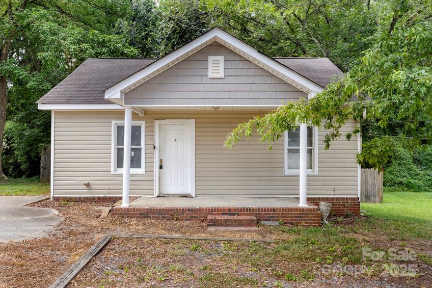 Location Location Location! This lovely 2-bed 1-bath needs a lot of TLC, but the homes around it are getting flipped or torn-down and new construction are between $415k-$465K.

Just right off W Sugar Creek Rd, N Tryon St, and few blocks away from I-85. 
About 12-15 minutes to Uptown Charlotte, and 16-18 minute from the Airport.

Might not qualify for regular financing, prefer cash, 203K construction loans, or ask to check with lender first.