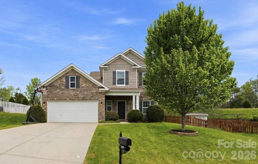 Welcome to this one-owner, well-maintained, move-in-ready home located on a quiet, low-traffic cul-de-sac. Bright, open floor plan featuring a white kitchen with a large island and breakfast area that flows into the great room with a gas fireplace. The main-level primary suite includes a spacious bedroom and an ensuite bathroom with dual vanities, a soaking tub, and a separate shower. A versatile room off the foyer can serve as a formal dining room or home office. The main level also includes a laundry room and two large coat closets with extra shelving for storage, and a half bath. Upstairs has 3 additional bedrooms and a flexible loft, all featuring decorative cabinets and shelving, as well as a full bath with dual sinks. The quiet, fenced-in backyard backs to open greenspace with nearby walking trails, disc golf, tennis/pickleball courts, and a pond with catch-and-release fishing. Community amenities also include a pool, clubhouse, and playground. Located in the highly rated Clover School District.