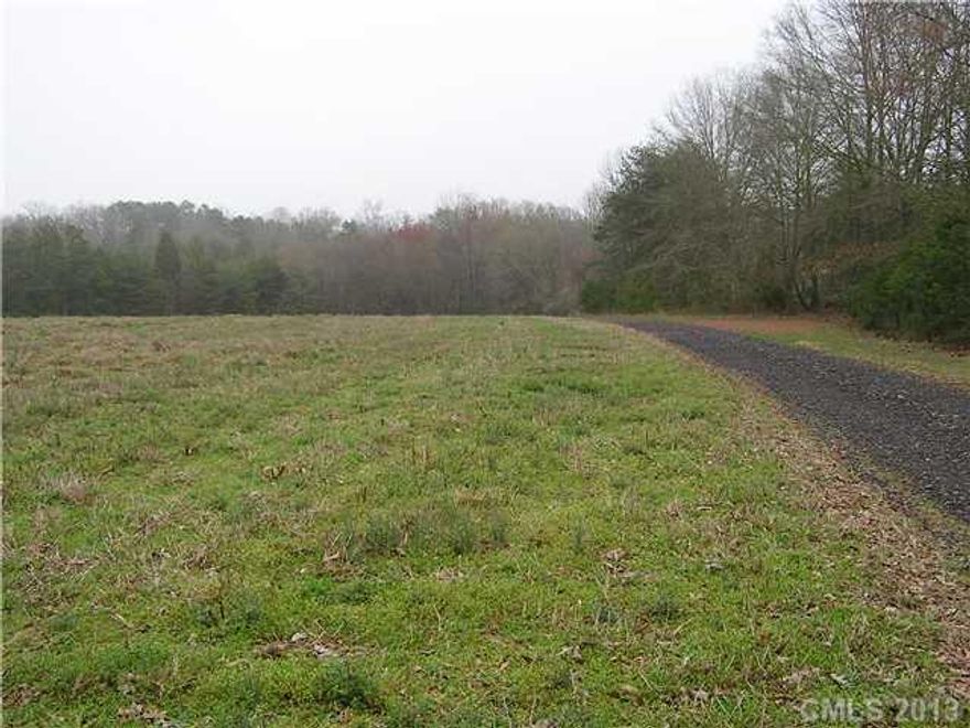15 Acres of rolling pasture with 2 acres of woods on a hill overlooking the balance in pasture or field.  Way back toward the end of a private road - privacy and isolation.  Currently being farmed.  Previous perk location was for 3 bedroom, may expand, needs updated.  Oakboro public utilities (water & Sewer) very close. May be a possibility. Nice area, nice homes around, great rural location just a couple miles off Hwy 24/27.  A mini farm in the making! $99,000 for 15 Acres!