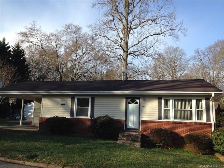 Wonderfully updated bungalow with new stove, newer refrigerator, replacement windows throughout,  and 2002 roof. Easy care brick and vinyl exterior and tall crawl space for extra storage. Built-ins include pantry, double door linen storage in hall and cute built-in display shelves in hall. Nice size great room for you and guests. Rear deck overlooks wide rear yard for out door enjoyment. Carport includes large utility closet with full laundry connections.