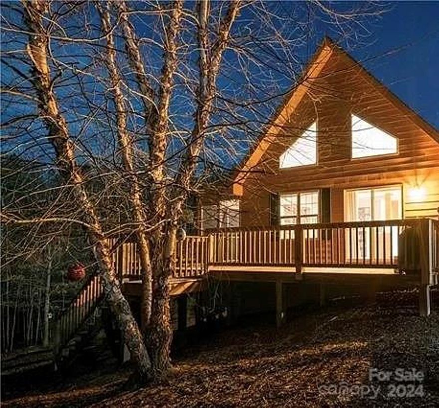 At the end of a private road sits this 1.5-story ranch cabin on 3.23 acres. The open deck is perfect for bird watching & star gazing Freshly painted throughout, this 3 bedroom, 2 bath home has everything you need on one level. The home has been wired for and comes with structured cabling in each room, and a portable, dual-fuel generator.  Upstairs, a new bonus room for entertainment or expansion, with a Mitsubishi Mini-split for heating/cooling and plenty of storage. Walk through your colorful perennial garden to your private fire pit area. Enjoy perennials like iris', crocosmia, daisies, lavender, butterfly bushes, black-eyed Susan, Russian sage, daylilies, gardenias, and several blueberries and black raspberry bushes. You can also meander down to the small creek at the rear of the property or create your own "Walk of Wonders" among the 3+ wooded acres. About 10 minutes to Ingles, 20 minutes to LL Marina and Chimney Rock, 30 minutes to Forrest City, Columbus, Marion and Rutherfordton.
