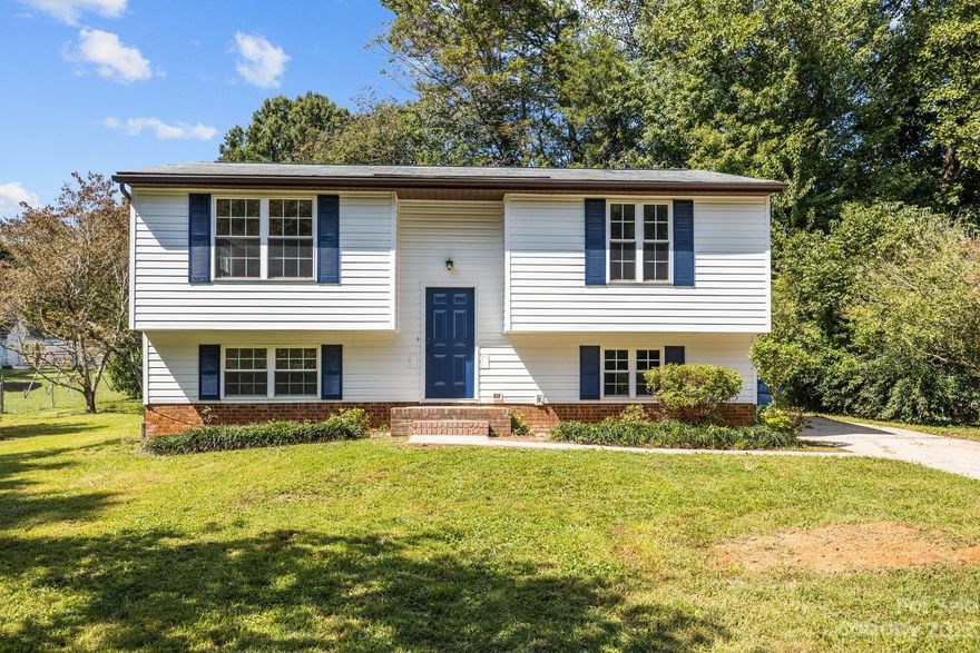 Completely Transformed 4-Bedroom, 2-Bathroom Gem in sought after Mint Hill! This spacious home features tons of natural light and fresh new finishes and fixtures for modern day living. This home has plenty of front and back yard with mature trees for privacy and quiet living within close distance to the bustle of Charlotte. The long driveway allows for up to 4 vehicles if needed and plenty of on street parking. This home is nestled in the quiet neighborhood of Wyndmere, 7 minutes from Mint Hill Downtown and all of your essentials such as groceries, pharmacy, and entertainment/dining. Fully upgraded kitchen appliances, cabinetry, countertops, bathroom vanities, new lighting and light fixtures in all rooms, fresh paint and SMOOTH ceilings, are amongst the many upgrades done to this beautiful home. Schedule a showing today!