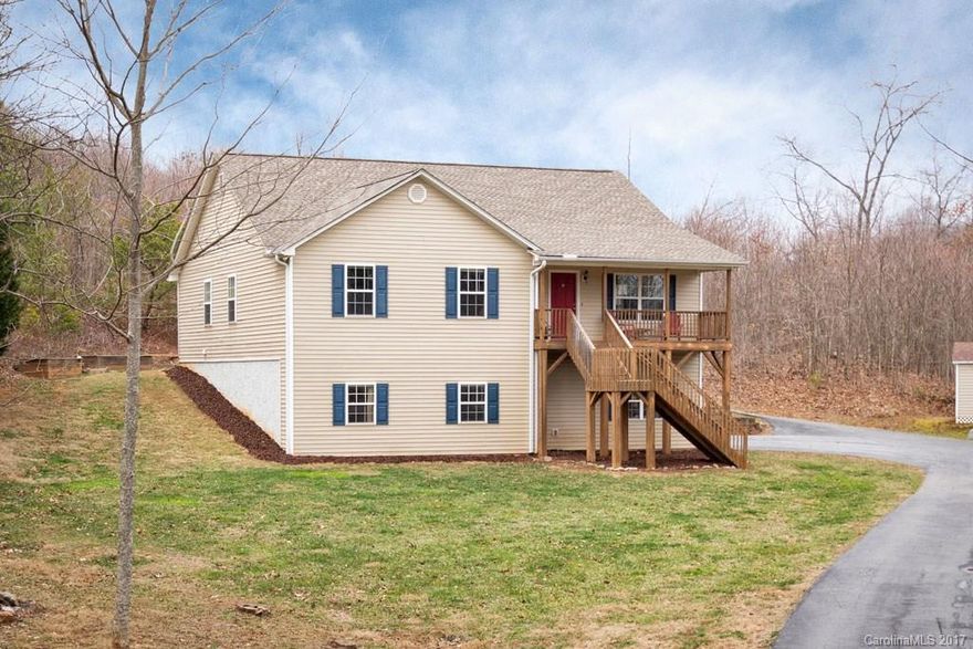 Two story Candler home on quiet, private lot. Home features two master suites, large carpeted media room and open kitchen/ family room. Updated eat-in kitchen has brand new stainless appliances, granite, and tile backsplash. Garage currently used as bakery is ideal for artist studio or workshop. Finished bonus room / show room has separate entrance. Wonderful updates throughout. Country living close to town. Large level yard, mountain views, raised garden beds, and elevated covered front porch.