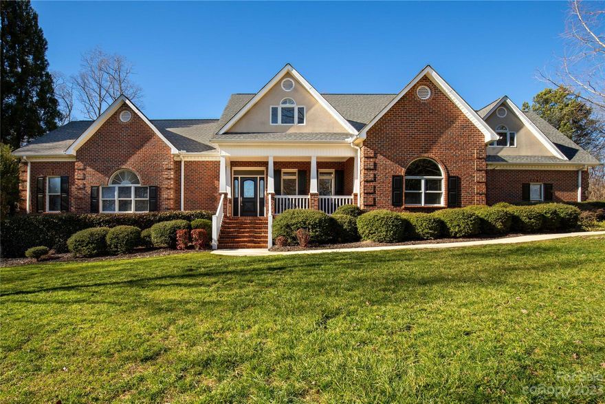 This stunning and sophisticated home is situated on a 2.5-acre double lot in a peaceful cul-de-sac located in Harlinsdale, one of the most coveted neighborhoods in Rock Hill. The house stands out with its grand and welcoming appearance. The exterior boasts an oversized concrete parking pad adjacent to the 2 car garage, which comes with an additional attached workshop. The backyard is secluded, and the screened-in rear porch and covered front porch provide an ideal spot to unwind. The interior is equally impressive, with gleaming hardwood floors, crown moldings, and an open floor plan that provides ample space for any occasion. The primary suite, complete with a soaking tub and separate shower, is located on the first floor. Upstairs, there are three more bedrooms, two full baths, and a bonus room that can be used as a bedroom or craft room, with its own half bath. The upstairs loft area is also spacious enough to serve as a second-floor living area. Hurry this beauty won't last!