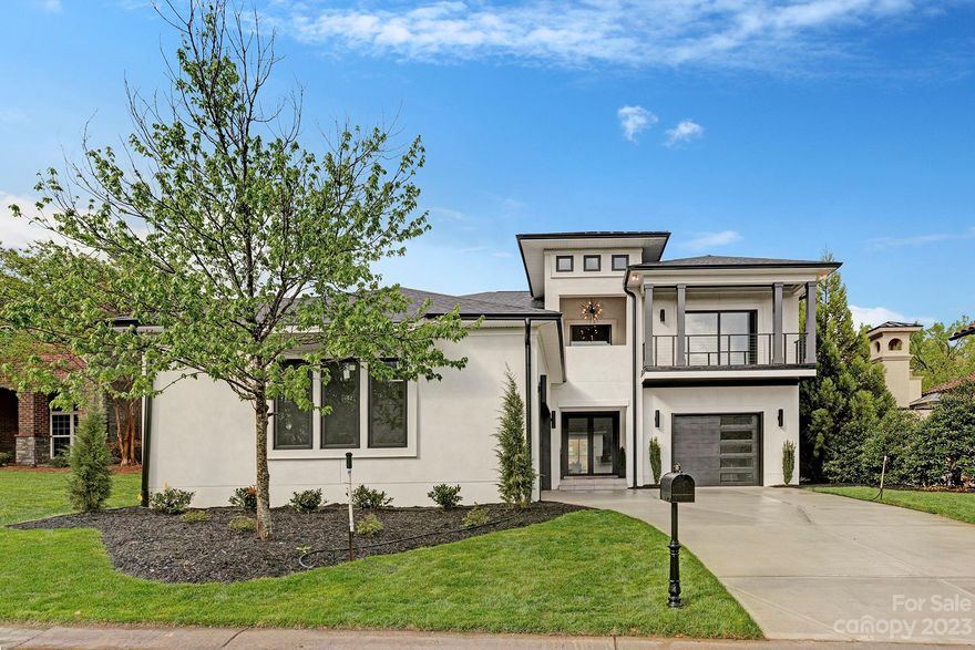 Modern mediterranean style home by A3 Custom Homes in the gated South Charlotte neighborhood Mediterra. Modern exterior and interior finishes with black windows and light colored 7" pre-finished hardwoods. The open floor plan features a primary suite, guest suite, wine room, walk in pantry, large kitchen island and wet bar on the main level. Primary suite has a vaulted ceiling, large walk in closet with an island, and an oversized shower. This home has a courtyard driveway with a 3 car garage setup that provides enough parking for 6 cars. You enter through modern double doors into a grand foyer leading into the living room w/ 11 ft high ceilings. Upstairs has 3 bedrooms, a loft, multiple patios and a large media room with built in speakers. The lot has large privacy trees along one side and a solid privacy wall along the back of the house. Amazing South Charlotte location with the modern features/finishes of a luxury new build. Home will be completed April 2023