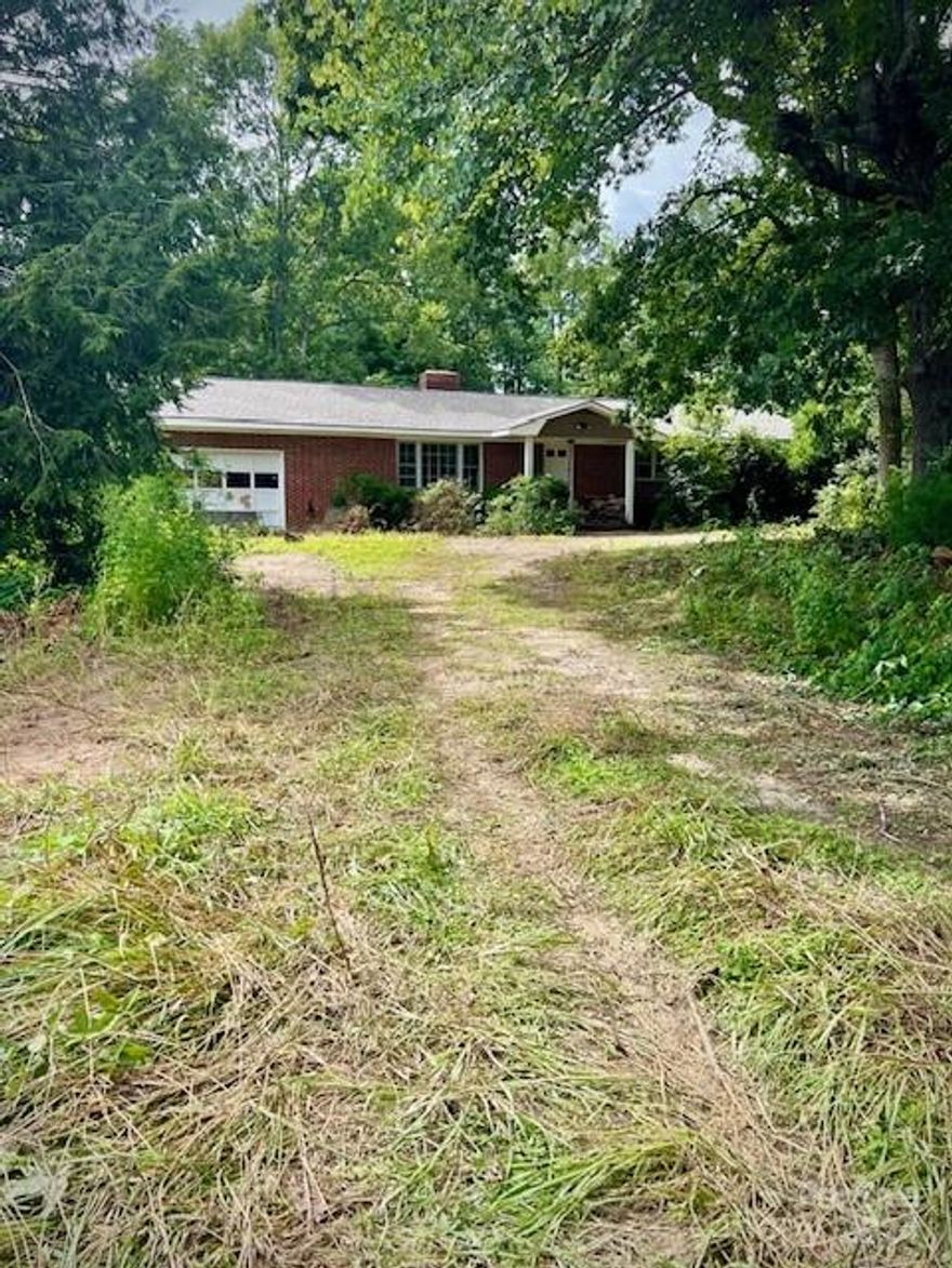 This could be country living at its best! All Brick home that sits on a little over 2 acres that has tons of potential with some TLC. Large building in the back could be used for extra storage or even a work shop. Home has a full unfinished walk out basement that could be finished for extra square footage. Garage on main level as well as basement level.
