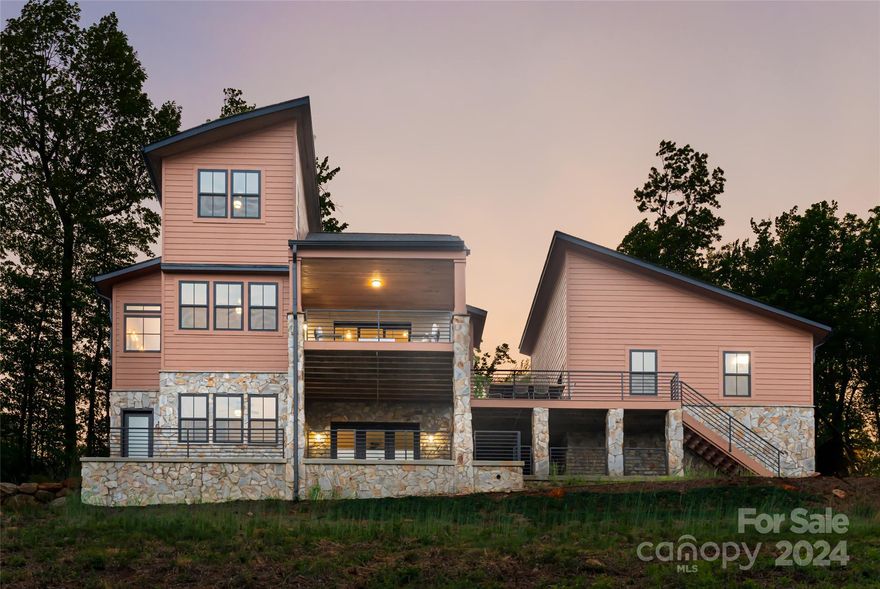 Nestled in the Blue Ridge Mountains, this modern mountain home offers unparalleled long-range views that stretch as far as the eye can see. Floor plan is designed for seamless indoor-outdoor living, with sliding doors that open to a covered deck, one-level living on the main level, and ample room for guests in the upper and lower levels. Upstairs has a bedroom and full bath, plus a versatile loft, great for an office or reading area. Downstairs, there's a private third bedroom, a full bath, and another living area, ideal for a game room, where friends and family can gather for endless entertainment. Abundant outdoor living space beckons you to experience the mountains in all seasons. Whether it's sipping coffee as the morning sun rises over the peaks, or sitting cozily under a blanket of stars, every moment here is a celebration of WNC living at its finest. This home is the perfect mountain escape — only 20 minutes to downtown Morganton and an hour to either Asheville or Charlotte.