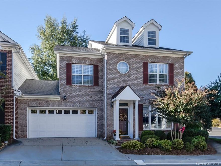 Beautiful full brick townhome in Ballantyne loc. Covered front porch will welcome you into this elegant home. Tile floors throughout entire main level.  Lovely arches surround the fireplace separating living area & formal DR.  Plantation shutters.  Create a meal in the kitchen w/corian counters, tons of cabinets & center island. Mstr BR is a retreat w/2 lrg closets. 3rd flr bonus perfect for reading or watching TV. Relax or entertain on back patio overlooking landscaped & private back yard.