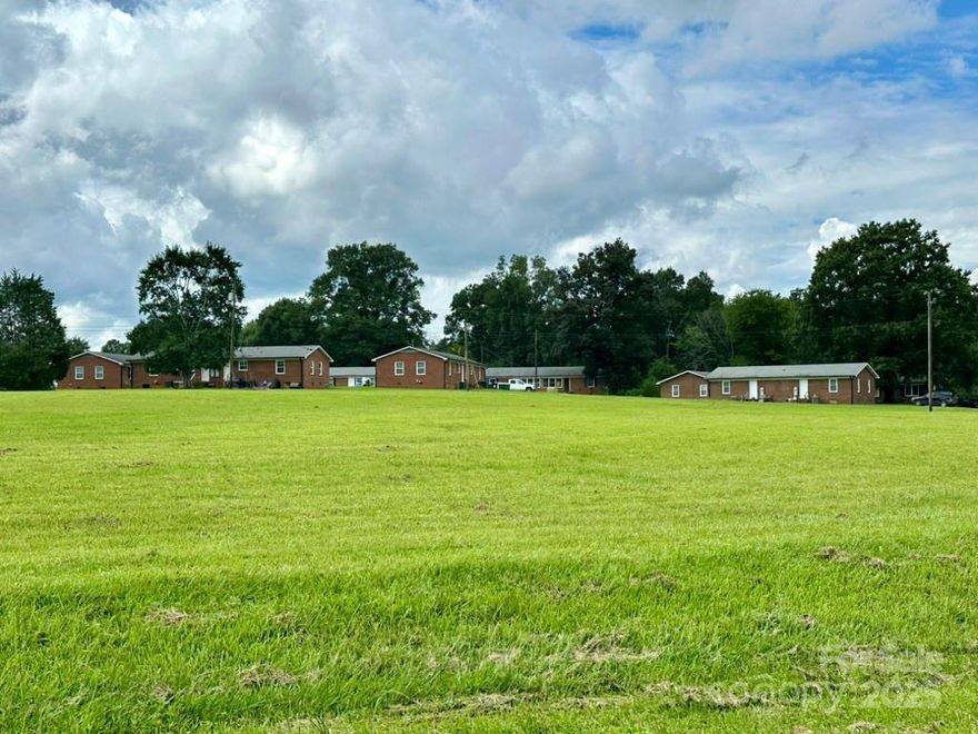 12 All brick buildings with 23 apartment units, approximately 21,900 heated square feet, on 8 acres, zoned Highway Business, average yearly operating income $212,676, average yearly expenses $102,452.58, average net income $110,223.  16 of the 23 units have been renovated with heat pumps, replacement windows, LVP flooring, paint, & fixtures.  There's room to build additional buildings & units if desired.  Property is serviced by public water supply & on site private sewer treatment system.  Great location right on Highway 52 just outside Phifer University & near Hwy 49 with quick commute to Kannapolis, Concord, & Charlotte NC.