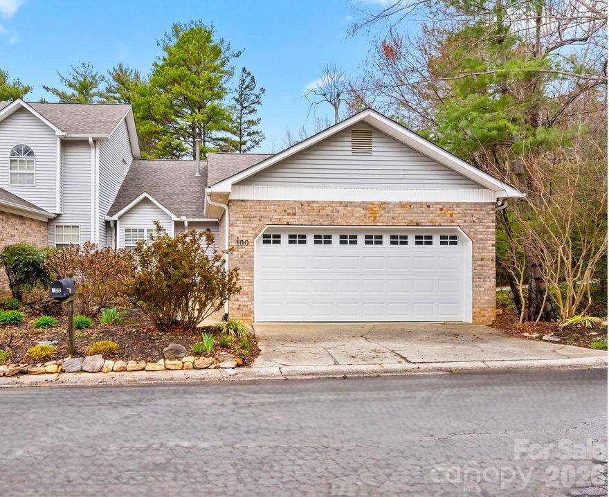 Nestled in a tree-lined setting, this spacious end-unit home offers the perfect blend of comfort and convenience. A light-filled open floor plan features multiple living areas, dining area, flex space, extra storage space, two covered porches, grill area, & a 2-car garage. Enjoy the peaceful wooded setting from your screened in porch or sit by the cozy fireplace on chilly mountain evenings. There is plenty of room for family and guests.  It almost feels like two homes in one!  The main level has everything you need including the laundry closet. The lower level boasts two additional bedrooms, a full bath, porch, den, and home office space. Creative? Use the flex areas as artist or craft spaces. KEY HIGHLIGHTS include updated flooring & baths, extended eat-in kitchen counter, updated appliances, new garage door, new roof, and a whole-house natural gas generator.  Ask your agent for a full feature list.  Located in a desirable planned neighborhood with easy access to shopping, dining, & outdoor recreation. The community also offers a club house, pool, & tennis courts. Conveniently located, only 15 minutes to downtown Asheville and the airport! Low maintenance, turn-key. Whether you're looking for a full-time residence or a mountain getaway, this property delivers unbelievable value. A must see to appreciate!