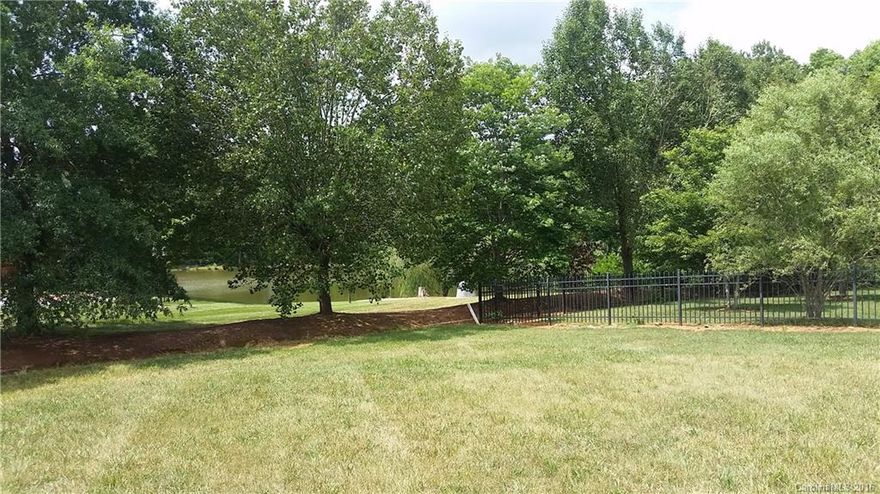 Level lot in beautiful Spring Forest subdivision.  Minimum 1700 square feet to build.  Brick required.  Architectural review required. Lot size to be verified by buyer.  HOA dues support street lights, walking trail, common area maintenance and occasional social events.  While this lot is not adjacent to pond, next door neighbors' lots are and there is currently a pond view from this lot.