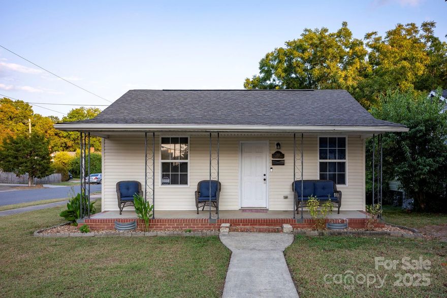Motivated seller. Corner-lot bungalow with a big backyard and brand-new HVAC! This charming 3BR/1BA, ~1,022 sq ft 1930s cottage sits on a level corner lot and offers an inviting front porch, bright living area, dining space, and efficient kitchen. The large, grassy backyard is ideal for play, pets, gardens, or future outdoor living. Enjoy quick access to I-77 (Exits 79 & 82) for easy commuting, plus close proximity to Old Town Rock Hill—home to Fountain Park, local restaurants, and year-round events. Outdoor lovers will appreciate nearby Glencairn Garden and the Piedmont Medical Center Trail along the Catawba River. New HVAC keeps things comfortable and worry-free. A great first home, downsize, or investment opportunity in a growing, revitalized area. 10 yr transferable warranty on HVAC. New roof 2024.