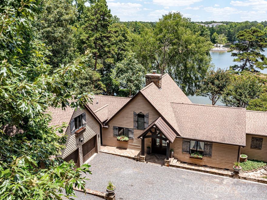 ABSOLUTELY AMAZING lakefront property with over 200 feet of idyllic shoreline in Charlotte, NC! Fantastic location approx 20 miles from Uptown Charlotte, 18 miles to the CLT Airport, close to country clubs, parks, trendy restaurants, and all the Lake Wylie amenities! What an exciting move-in ready property with NO HOA nor rental restrictions! Impressively renovated, this 3 bedroom, 3.5 bath split plan home provides great privacy and ample space for gathering and fun! The large bonus room over the 2 car connected garage is tailor made for enjoyment. Professionally designed with floor to ceiling windows and dramatic vaulted ceilings to maximize the gorgeous lake views. Exquisite custom features in every room! Outside is a lake lover's paradise with approx 876 SF of decking perfect for entertaining and loving our Carolina weather! Enjoy the deep water from the expansive stationary dock, water craft floating dock, and covered boat lift with tons of storage space! You will LOVE this home!