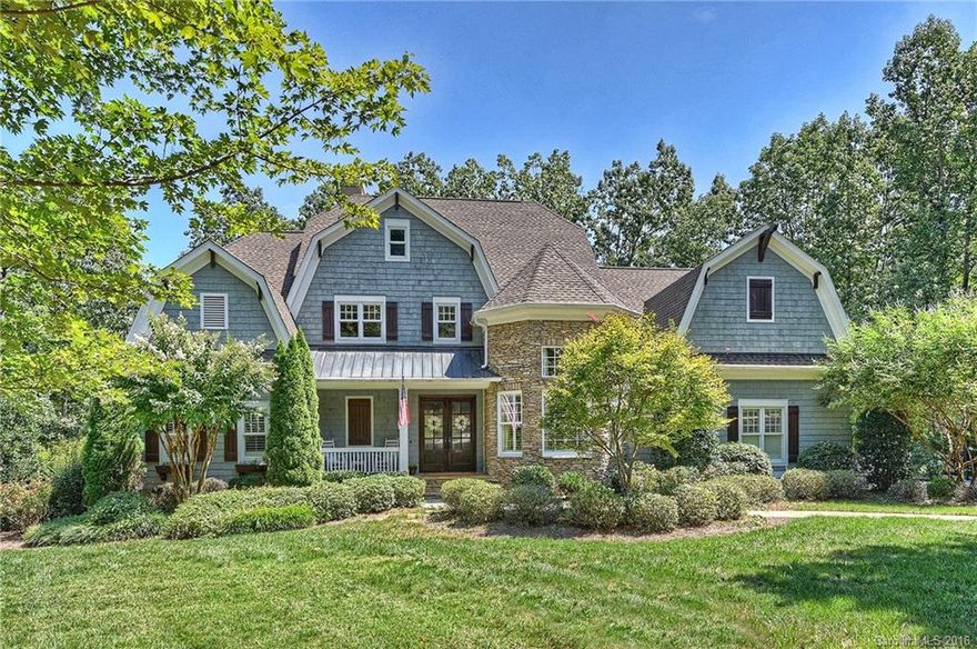 Gorgeous waterfront Cape Cod with finished basement, private dock on wide open cove & 140+ ft of shoreline in The Point! This custom Arcadia built home exudes the highest quality on all three levels. Open floor plan with main level master retreat & private office, beautifully equipped kitchen with center island overlooking breakfast and family room that flows to lakefront terrace. Upper level with 3 BR suites, large bonus & modern built-in features. Wow lake level living/rec spaces with 5th BR!